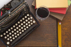 typewriter-wine-books-old-vintage-glass-pencils-retro-creative-writing-relazation-themed-desk-top-62558750